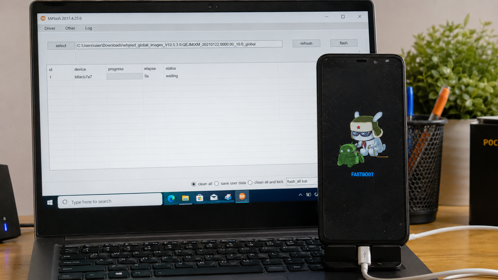 Imagem ilustrativa: Celular Xiaomi em Fastboot conectado ao computador com MiFlash aberto